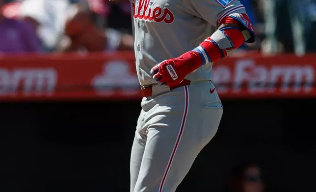 Philadelphia Phillies' Edmundo Sosa rounds the bases after hitting a solo home run during the seventh inning of a baseball game against the Los Angeles Angels, Sunday, Aug. 30, 2026, in Anaheim, Calif. (AP Photo/Caroline Brehman)