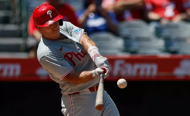 Philadelphia Phillies' J.T. Realmuto hits a solo home run during the third inning of a baseball game against the Los Angeles Angels, Sunday, Aug. 30, 2026, in Anaheim, Calif. (AP Photo/Caroline Brehman)