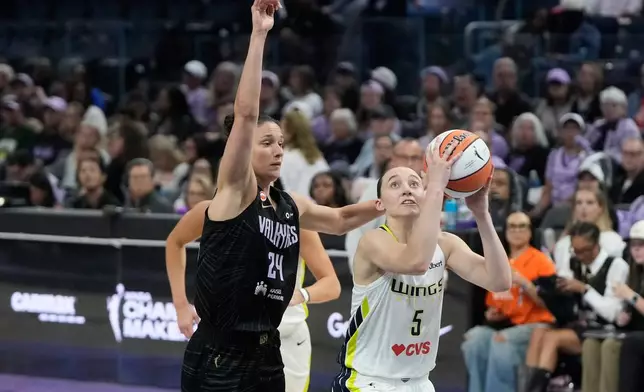 Dallas Wings guard Paige Bueckers (5) shoots against Golden State Valkyries forward Cecilia Zandalasini (24) during the second half of a WNBA basketball game in San Francisco, Monday, Aug. 17, 2026. (AP Photo/Jeff Chiu)