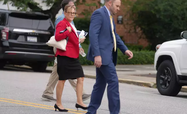 Sen. Darline Graham, R-S.C., walks across a street to a television studio for a debate with four other Republicans competing in a special Senate primary to replace her brother, Sen. Lindsey Graham, R-S.C., on Monday, Aug. 3, 2026, in Columbia, S.C. (AP Photo/Meg Kinnard)