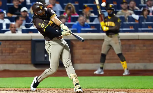 San Diego Padres' Fernando Tatis Jr. hits a two run home run against the New York Mets during the fifth inning of a baseball game, Tuesday, Aug. 18, 2026, in New York. (AP Photo/Noah K. Murray)