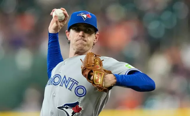 Toronto Blue Jays starting pitcher Shane Bieber throws during the first inning of a baseball game against the Houston Astros Monday, Aug. 3, 2026, in Houston. (AP Photo/David J. Phillip)