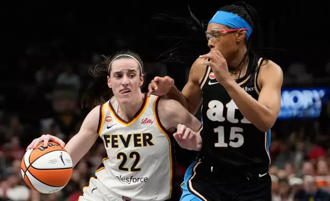 Indiana Fever guard Caitlin Clark (22) dribbles against Atlanta Dream guard Allisha Gray (15) in the overtime during an WNBA basketball game Sunday, Aug. 16, 2026, in Atlanta. (AP Photo/Brynn Anderson)