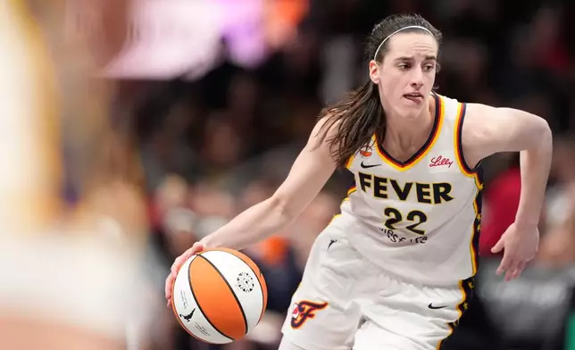 Indiana Fever guard Caitlin Clark (22) dribbles the ball in the second half of an WNBA basketball game against the Atlanta Dream Sunday, Aug. 16, 2026, in Atlanta. (AP Photo/Brynn Anderson)