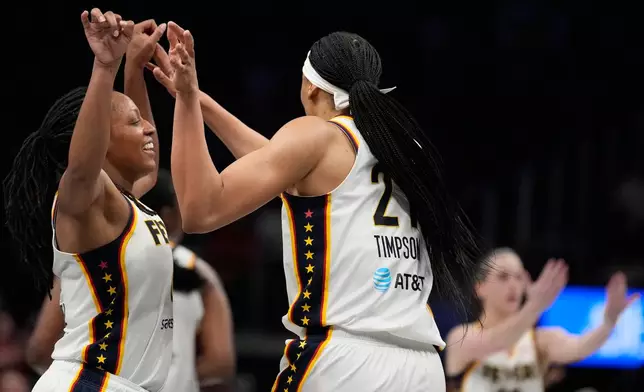 Indiana Fever forward Makayla Timpson (21) celebrates with Indiana Fever center Aliyah Boston (7) in the overtime during an WNBA basketball game against the Sunday, Aug. 16, 2026, in Atlanta. (AP Photo/Brynn Anderson)