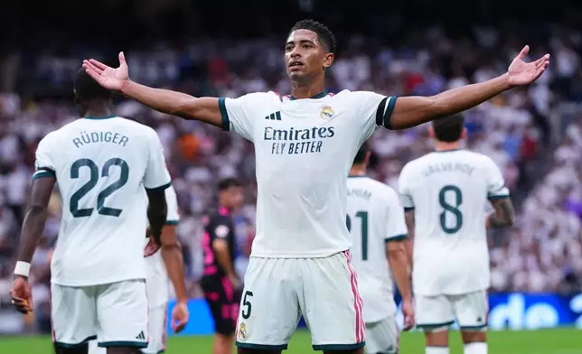 Real Madrid's Jude Bellingham celebrates after Malaga's own goal during the La Liga soccer match between Real Madrid and Malaga in Madrid, Spain, Sunday, Aug. 30, 2026. (AP Photo/Manu Fernandez)