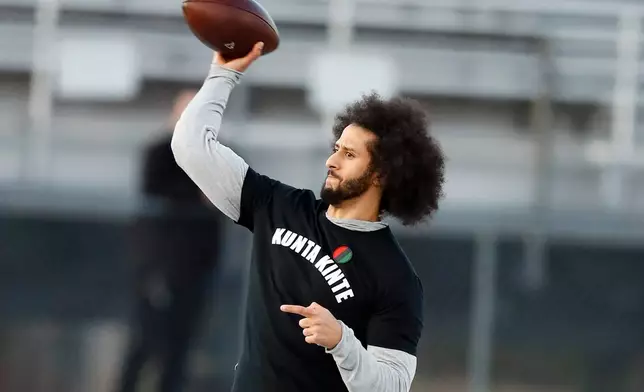 FILE - In this Nov. 16, 2019, file photo, free agent quarterback Colin Kaepernick participates in a workout for NFL football scouts and media in Riverdale, Ga. (AP Photo/Todd Kirkland, File)