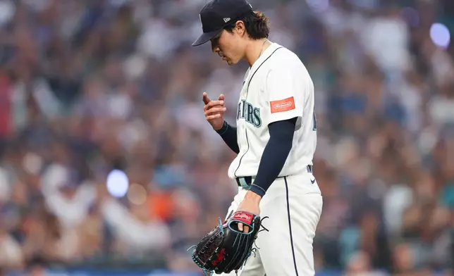 Seattle Mariners pitcher Bryan Woo (22) reacts after the seventh inning of a baseball game against the Detroit Tigers, Wednesday, Aug. 5, 2026, in Seattle. (AP Photo/Kevin Ng)