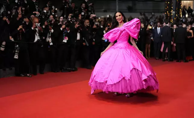 FILE - Jury member Demi Moore appears at the premiere of the film "Paper Tiger" at the 79th international film festival, Cannes, southern France, on May 16, 2026. (Photo by Scott A Garfitt/Invision/AP, File)