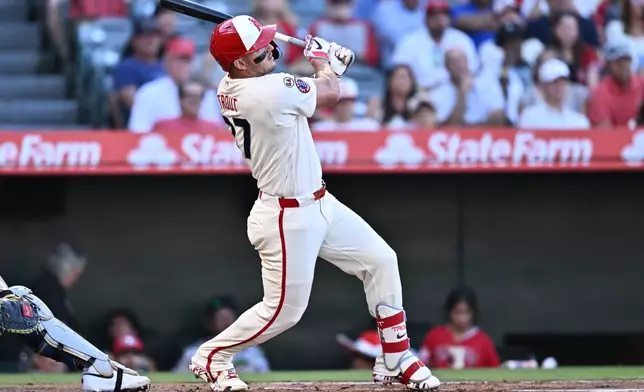 Los Angeles Angels' Mike Trout hits a single during the first inning of a baseball game against the Milwaukee Brewers, Saturday, Aug. 1, 2026, in Anaheim, Calif. (AP Photo/William Liang)