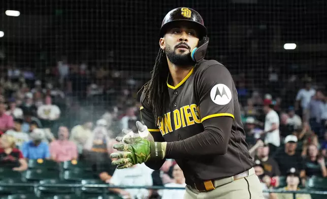 San Diego Padres' Fernando Tatis Jr. gets ready to hit against the Arizona Diamondbacks in the first inning of a baseball game, Thursday, Aug 6, 2026, in Phoenix. (AP Photo/Rick Scuteri)