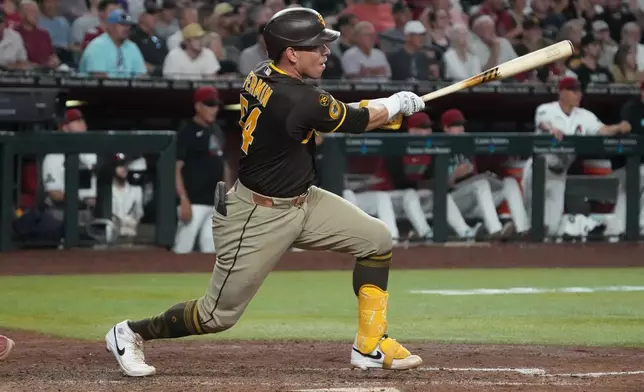 San Diego Padres' Freddy Fermin hits an RBI single against the Arizona Diamondbacks in the sixth inning of a baseball game, Thursday, Aug 6, 2026, in Phoenix. (AP Photo/Rick Scuteri)