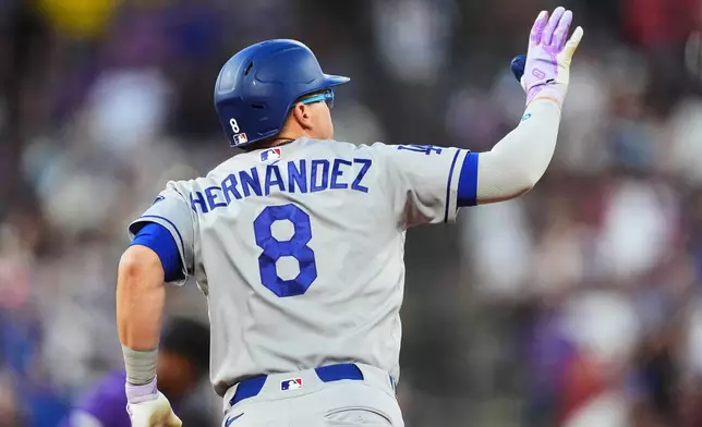 Los Angeles Dodgers' Enrique Hernández gestures to the bullpen as he circles the bases after hitting a two-run home run off Colorado Rockies starting pitcher Kyle Freeland in the fourth inning of a baseball game Wednesday, Aug. 19, 2026, in Denver. (AP Photo/David Zalubowski)