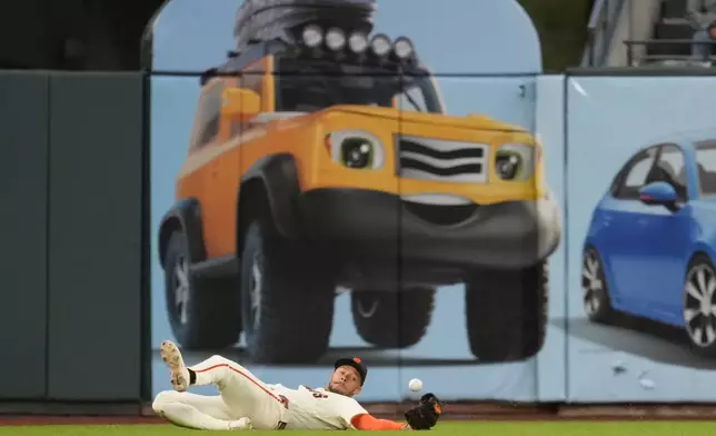San Francisco Giants left fielder Grant McCray cannot catch an RBI double hit by Arizona Diamondbacks' Lars Nootbaar during the third inning of the second baseball game of a doubleheader, Saturday, Aug. 29, 2026, in San Francisco. (AP Photo/Jeff Chiu)