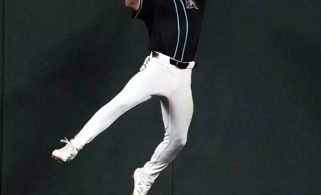 Arizona Diamondbacks center fielder Ryan Waldschmidt catches a ball hit by Colorado Rockies' Hunter Goodman in the sixth inning of a baseball game, Monday, Aug 10, 2026, in Phoenix. (AP Photo/Rick Scuteri)