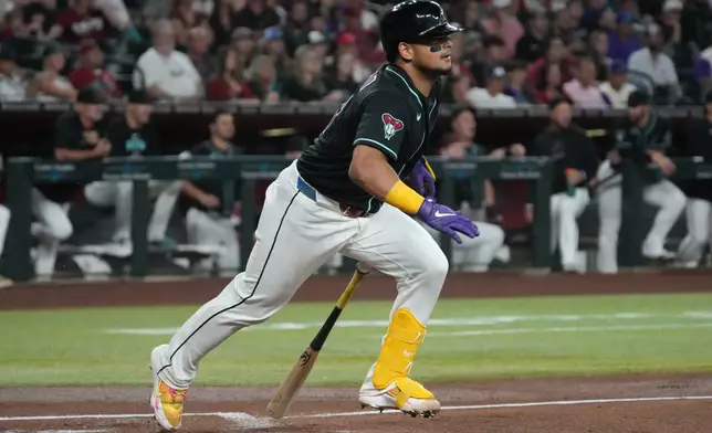 Arizona Diamondbacks' Gabriel Moreno watches his triple against the Colorado Rockies in the second inning of a baseball game, Monday, Aug 10, 2026, in Phoenix. (AP Photo/Rick Scuteri)