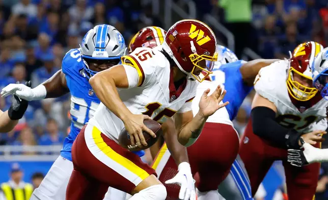 Washington Commanders quarterback Sam Hartman (15) runs the ball during a preseason NFL football game against the Detroit Lions, Saturday, Aug. 22, 2026, in Detroit. (AP Photo/Rey Del Rio)