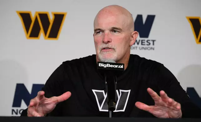 Washington Commanders head coach Dan Quinn speaks during a post game news conference after an NFL preseason football game against the Miami Dolphins, Friday, Aug. 14, 2026, in Landover, MD. (AP Photo/Nick Wass)