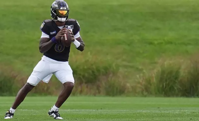 Baltimore Ravens quarterback Lamar Jackson trains during a joint NFL football practice with the Minnesota Vikings, Thursday, Aug. 20, 2026, in Eagan, Minn. (AP Photo/Abbie Parr)