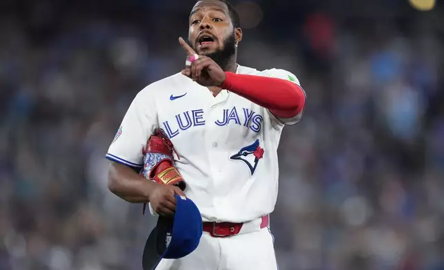 Toronto Blue Jays first baseman Vladimir Guerrero Jr. (27) reacts to the Boston Red Sox dugout after hitting into a double play during fifth inning American League MLB baseball action in Toronto on Wednesday, August 12, 2026. (Nathan Denette/The Canadian Press via AP)