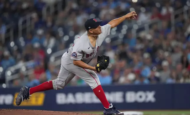 Boston Red Sox pitcher Ranger Suarez works against the Toronto Blue Jays during first inning of a baseball game in Toronto on Wednesday, August 12, 2026. (Nathan Denette/The Canadian Press via AP)