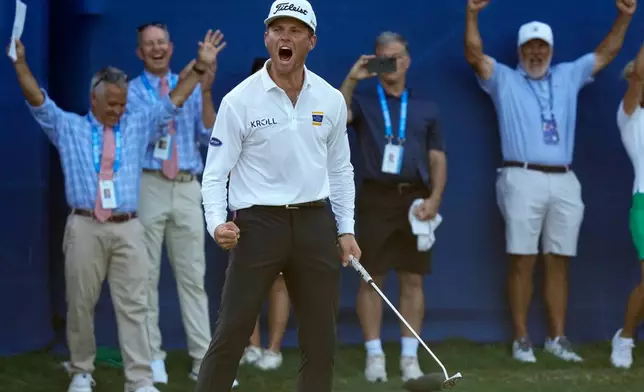 Michael Brennan reacts after winning the Wyndham Championship golf tournament in Greensboro, N.C., Sunday, Aug. 9, 2026. (AP Photo/Chuck Burton)