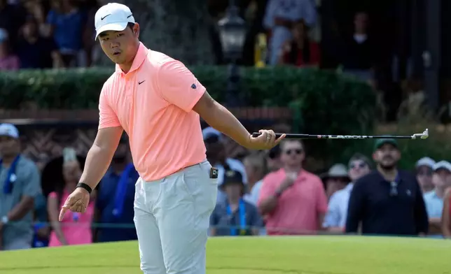 Tom Kim, of South Korea, reacts to a missed putt on the ninth hole during the final round of the Wyndham Championship golf tournament in Greensboro, N.C., Sunday, Aug. 9, 2026. (AP Photo/Chuck Burton)