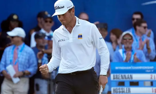 Michael Brennan reacts after winning the Wyndham Championship golf tournament in Greensboro, N.C., Sunday, Aug. 9, 2026. (AP Photo/Chuck Burton)
