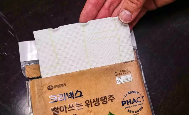 A multi-use compostable paper towel that contains plastic from plants is displayed at CJ Biomaterials, Monday, Aug. 3, 2026, in Woburn, Mass. (AP Photo/Charles Krupa)