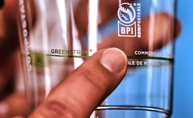 The BPI logo is displayed on a cup made from bioplastic pellets, which is certified by the Biodegradable Products Institute as compostable, at CJ Biomaterials, Monday, Aug. 3, 2026, in Woburn, Mass. (AP Photo/Charles Krupa)