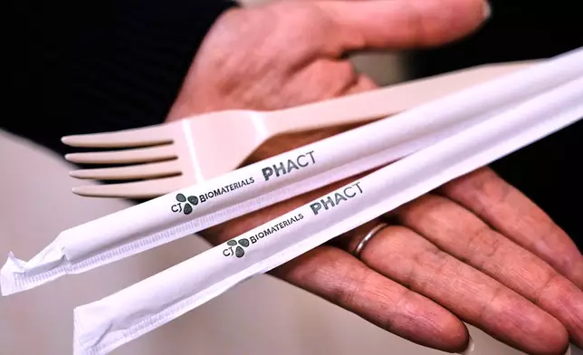 Compostable straws and a fork, which were made from plastic made from plants, are displayed at CJ Biomaterials, Monday, Aug. 3, 2026, in Woburn, Mass. (AP Photo/Charles Krupa)