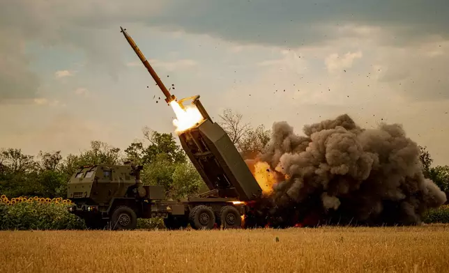 A Ukrainian HIMARS crew, attached to the 148th brigade, fires rockets at Russian positions, on the front line in eastern Ukraine, Saturday, Aug. 8, 2026. (AP Photo/Dan Bashakov)