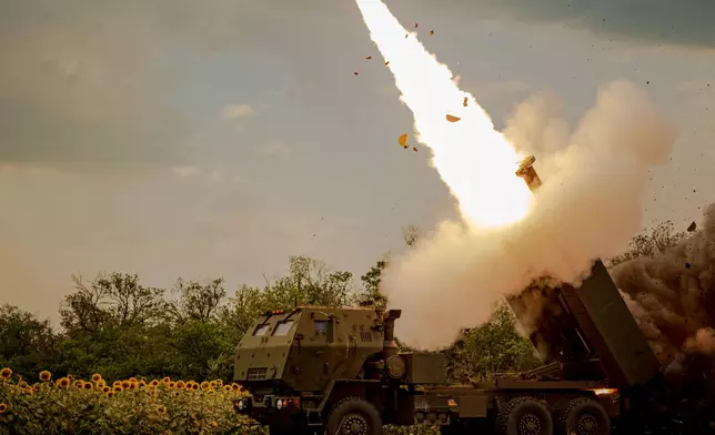 A Ukrainian HIMARS crew, attached to the 148th brigade, fires rockets at Russian positions, on the front line in eastern Ukraine, Saturday, Aug. 8, 2026. (AP Photo/Dan Bashakov)