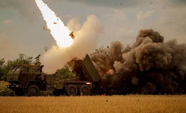 A Ukrainian HIMARS crew, attached to the 148th brigade, fires rockets at Russian positions, on the front line in eastern Ukraine, Saturday, Aug. 8, 2026. (AP Photo/Dan Bashakov)