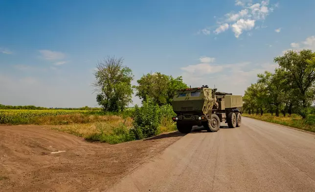 A Ukrainian HIMARS crew, attached to the 148th brigade, takes a position on the front line in eastern Ukraine, to fire rockets at Russian positions, Saturday, Aug. 8, 2026. (AP Photo/Dan Bashakov)