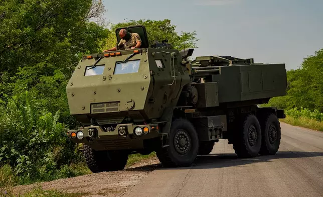A Ukrainian HIMARS crew, attached to the 148th brigade, takes a position on the front line in eastern Ukraine, to fire rockets at Russian positions, Saturday, Aug. 8, 2026. (AP Photo/Dan Bashakov)