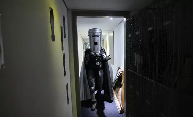 Count Binface leaves after being interviewed at a studio in London ahead of the Clacton by-election, Wednesday, July 29, 2026. (AP Photo/Kirsty Wigglesworth)