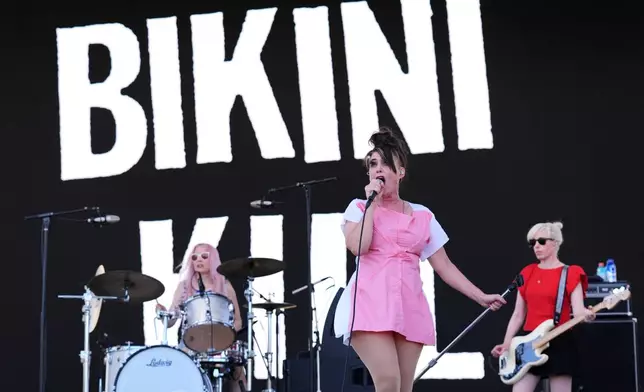 From left, Tobi Vail, Kathleen Hanna and Kathi Wilcox of Bikini Kill perform at the Daisy Chain Fields Music Festival on Saturday, Aug. 29, 2026, at Great Park in Irvine, Calif. (AP Photo/Chris Pizzello)