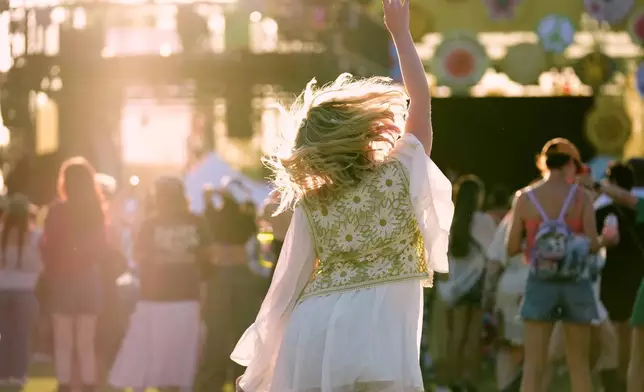 A festivalgoer dances during the band Garbage's set during the Daisy Chain Fields Music Festival on Saturday, Aug. 29, 2026, at Great Park in Irvine, Calif. (AP Photo/Chris Pizzello)
