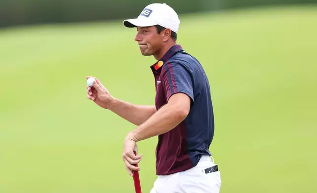 Viktor Hovland, of Norway, reacts on the 18th hole during the second round of the Tour Championship golf tournament, Friday, Aug. 28, 2026, in Atlanta. (AP Photo/Colin Hubbard)