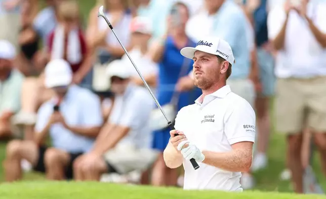 Ryan Gerard plays a shot from a bunker on the 18th hole during the second round of the Tour Championship golf tournament, Friday, Aug. 28, 2026, in Atlanta. (AP Photo/Colin Hubbard)