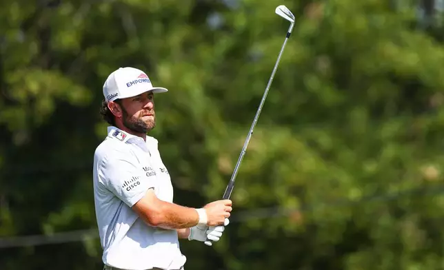 Cameron Young watches his shot from the fairway on the first hole during the second round of the Tour Championship golf tournament in Atlanta, Friday, Aug. 28, 2026. (AP Photo/Colin Hubbard)