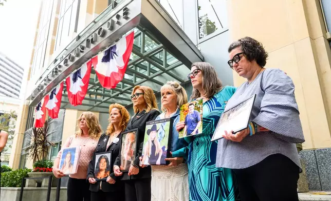 Parents hold pictures of their deceased children during a protest against social media platforms outside the Ronald V. Dellums Federal Building and U.S. Courthouse on Tuesday, Aug. 18, 2026, in Oakland, Calif. (AP Photo/Noah Berger)