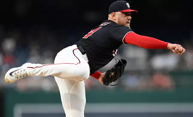 Washington Nationals pitcher Cade Cavalli follows through during the first inning of a baseball game against the Cincinnati Reds, Friday, Aug. 7, 2026, in Washington. (AP Photo/John McDonnell)