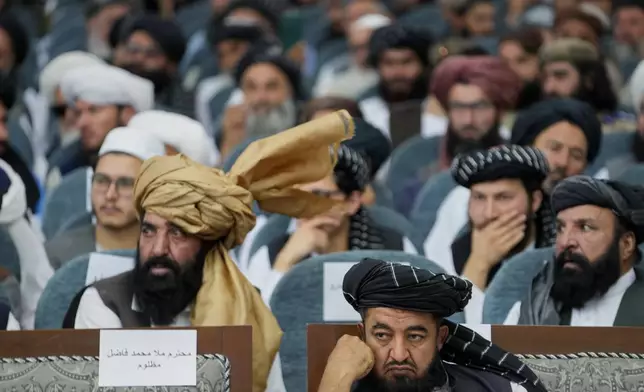 Taliban delegates from across the country attend a meeting that opens celebrations marking the fifth anniversary of the U.S. withdrawal and the start of Taliban rule, at the Loya Jirga Hall in Kabul, Afghanistan, Saturday, Aug. 15, 2026. (AP Photo/Siddiqullah Alizai)