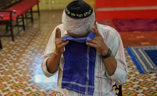 Elias Josephai, a Malabari Jew, wipes away tears while speaking to The Associated Press at the 12th-century Kadavumbagam Synagogue in Ernakulam, mainland district of Kochi, India, Thursday, May 21, 2026. (AP Photo/Aijaz Rahi)