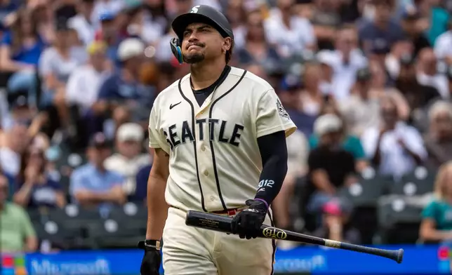 Seattle Mariners' Josh Naylor reacts after popping out during the sixth inning of a baseball game against the Tampa Bay Rays, Sunday, Aug. 9, 2026, in Seattle. (AP Photo/Stephen Brashear)