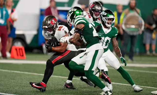 Tampa Bay Buccaneers running back Josh Williams (18) scores a touchdown during the second half of a preseason NFL football game against the New York Jets, Friday, Aug. 14, 2026, in East Rutherford, N.J. (AP Photo/Seth Wenig)