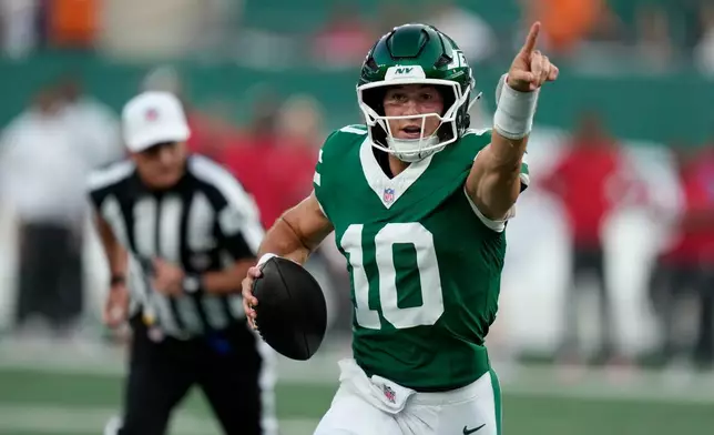 New York Jets quarterback Cade Klubnik runs up field during the first half of a preseason NFL football game against the Tampa Bay Buccaneers, Friday, Aug. 14, 2026, in East Rutherford, N.J. (AP Photo/Seth Wenig)