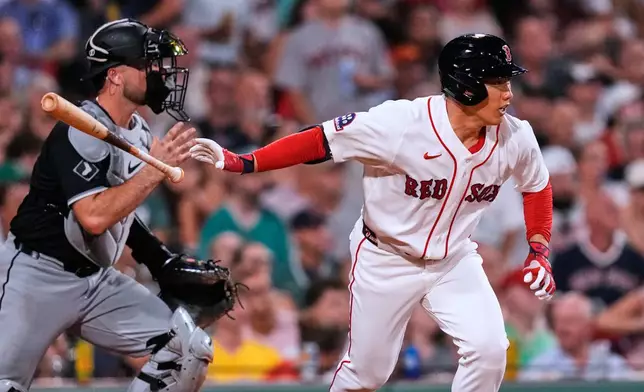 Boston Red Sox's Masataka Yoshida watches the flight of his single during the fourth inning of a baseball game against the Chicago White Sox, Thursday, Aug. 6, 2026, in Boston. (AP Photo/Charles Krupa)